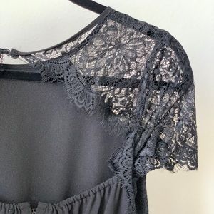 Dressy, black jumpsuit with delicate lace sleeves!